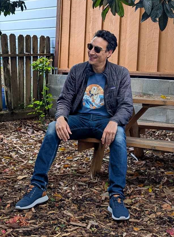 Sean Cook sitting in his backyard.