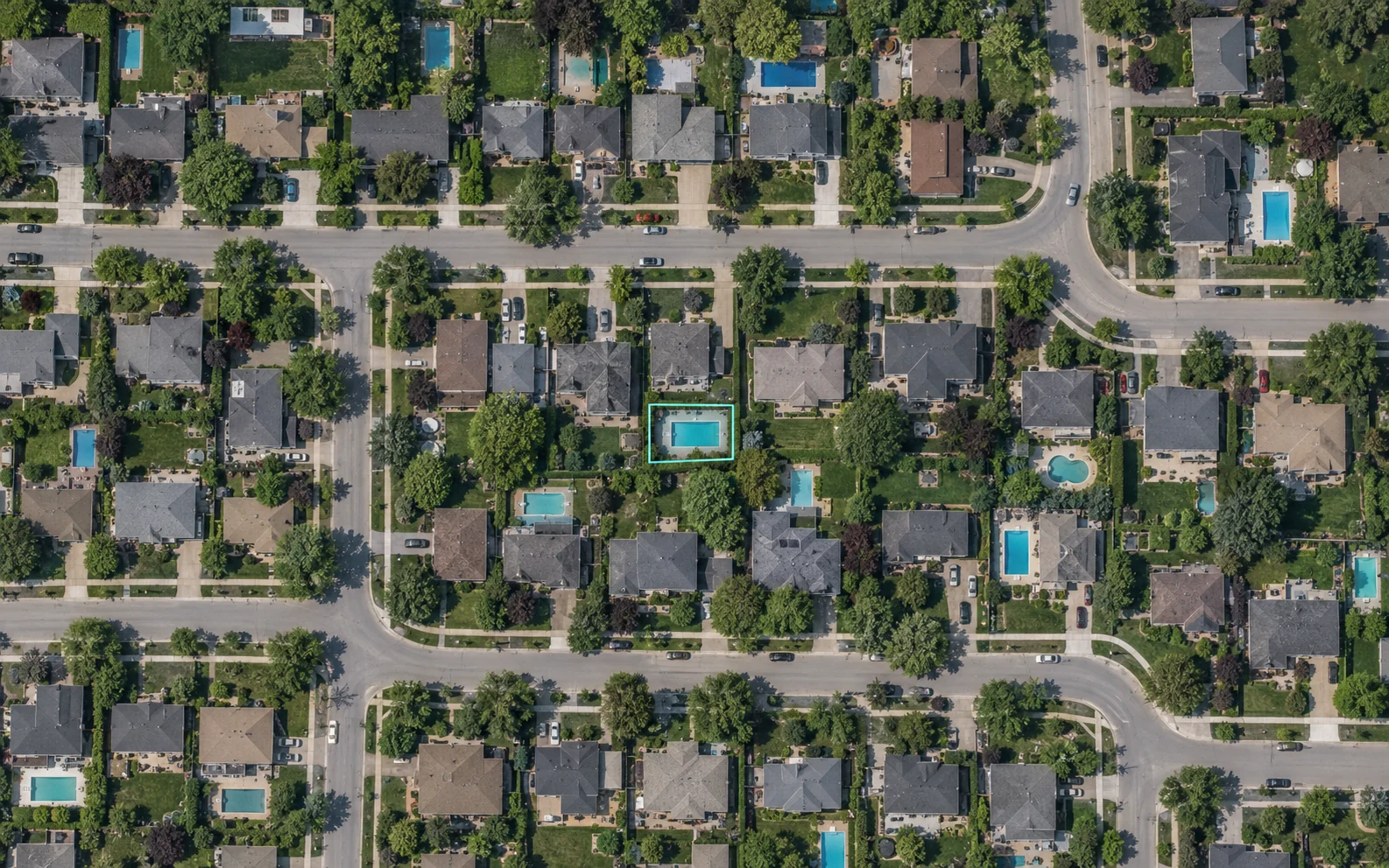 AI-generated satellite-style neighborhood view with backyard swimming pools